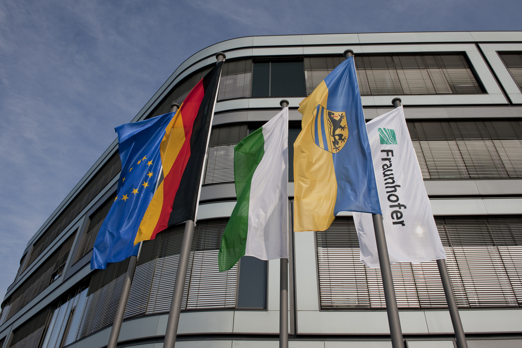 Exterior view of the Fraunhofer IZI building: Detail with flags.