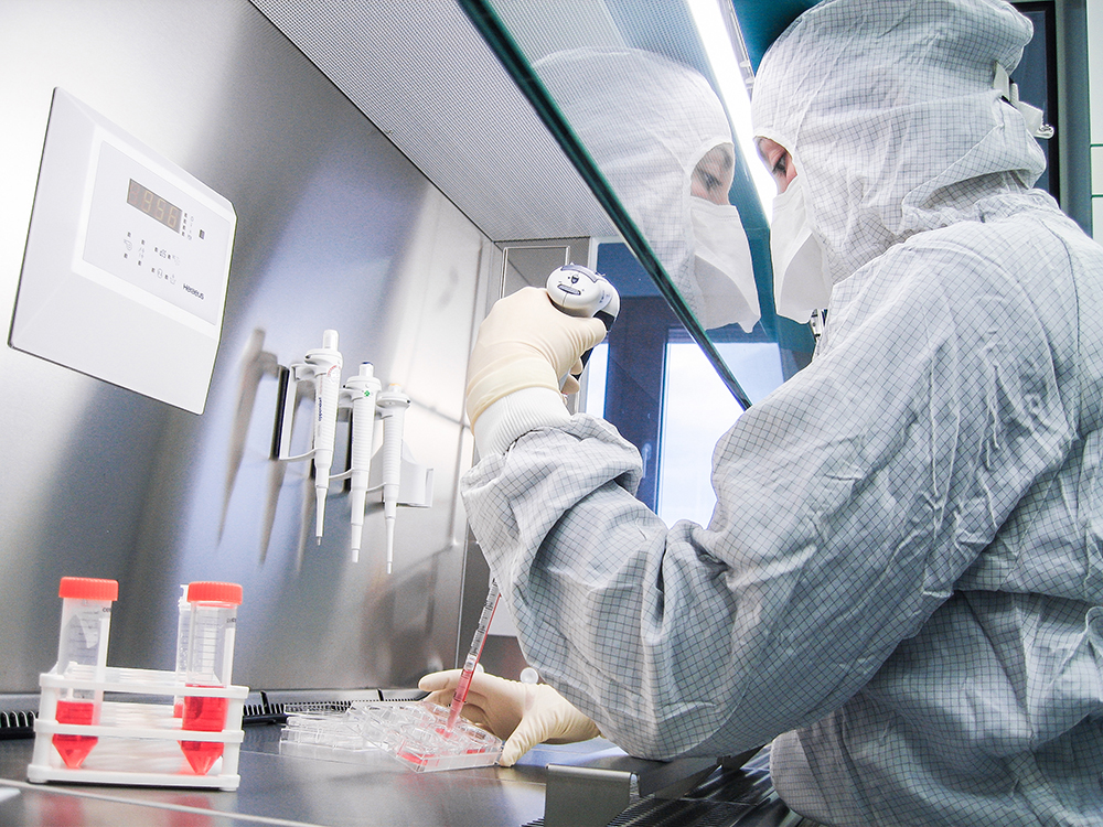 Woman working in cleanroom facility