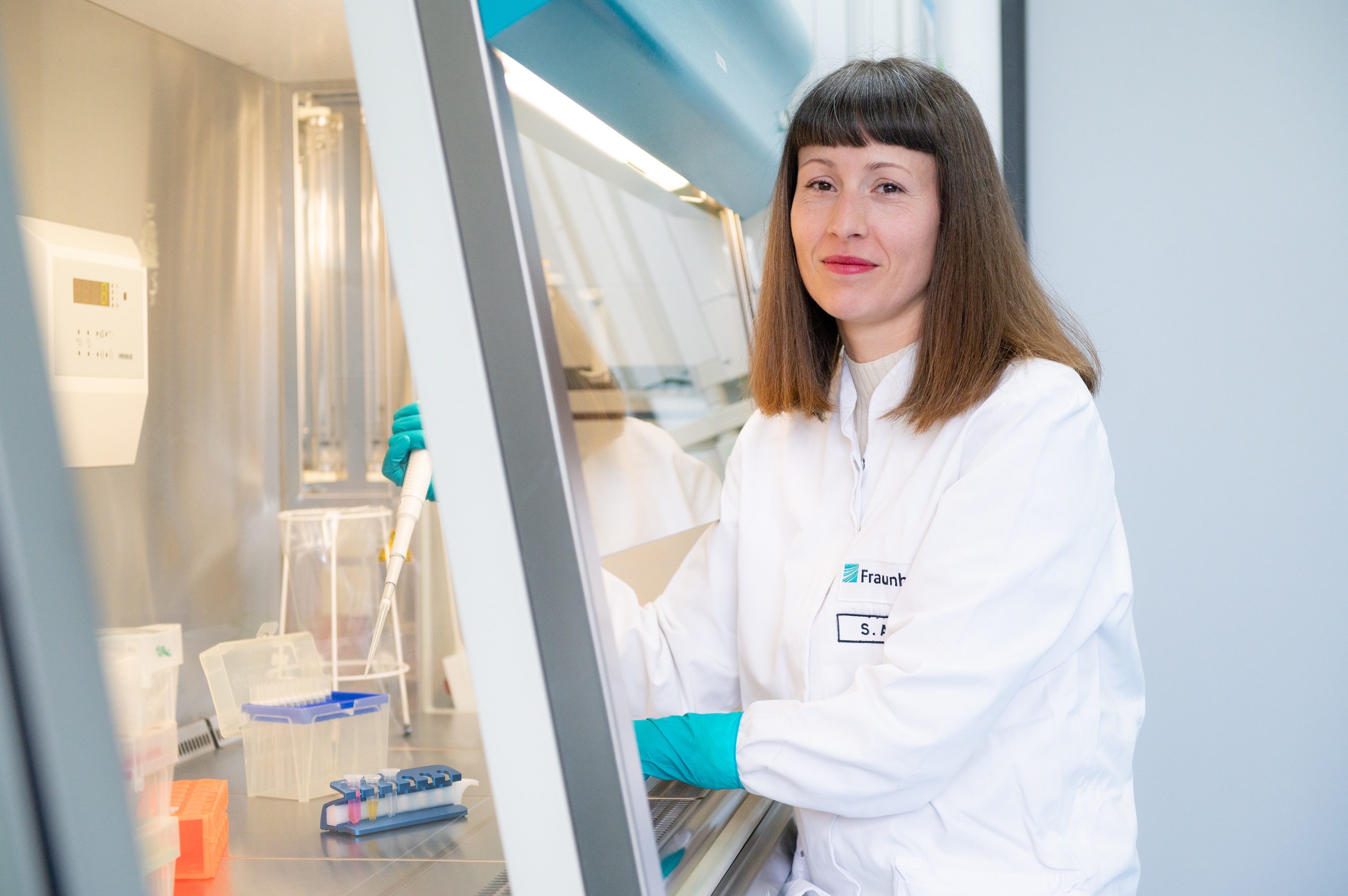 Scientist in a white coat in the lab