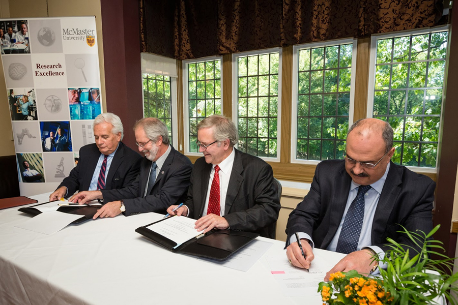 From left to right: Stephen Collins, associate dean of research in McMaster’s Faculty of Health Sciences, Patrick Deane, McMaster’s president &amp; vice-chancellor, Frank Emmrich, director of the Fraunhofer IZI, and Mo Elbestawi, McMaster’s vice-president of research &amp; international affairs