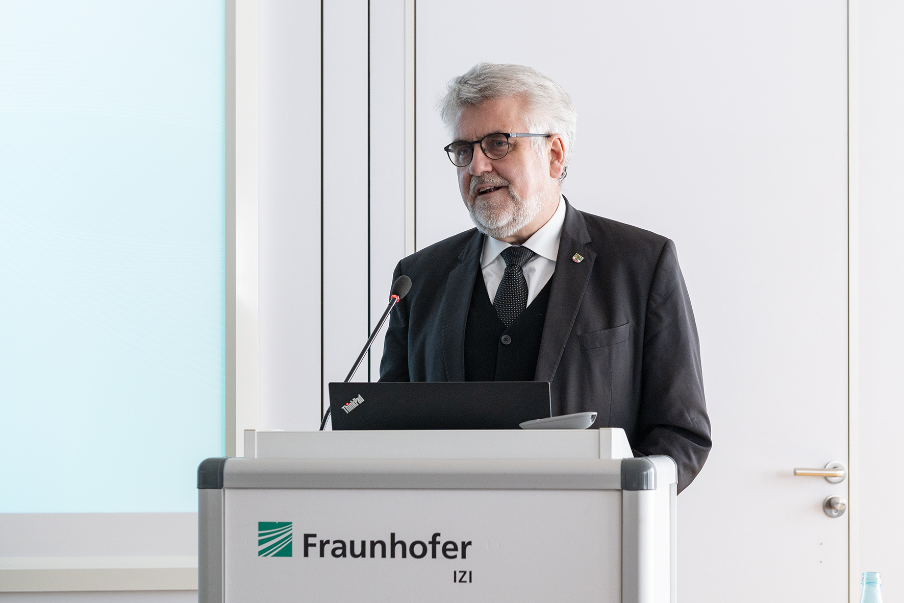 Saxony-Anhalt Economics Minister behind lectern